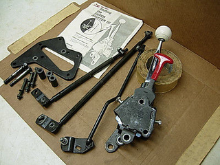 Hurst Super Shifter 3. You use the red handle to engage/disengage the reverse lockout